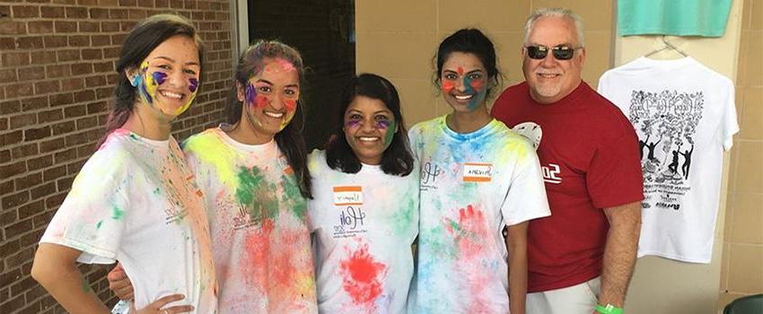 Dr. Carter with Students at Holi Fest